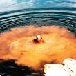 Jim Mangan. Orange cloud in lake 
