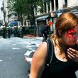 Афины (Греция). Демонстрантка, раненная в столкновении с полицией в центре Афин. 11 мая 2011 года